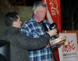 David Lamont (Lisburn Cathedral) reading a portion of Scripture by torchlight provided by the Rev Paul Dundas, rector of Christ Church Parish.